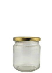 Bocal en verre transparent avec couvercle doré, idéal pour conservation alimentaire