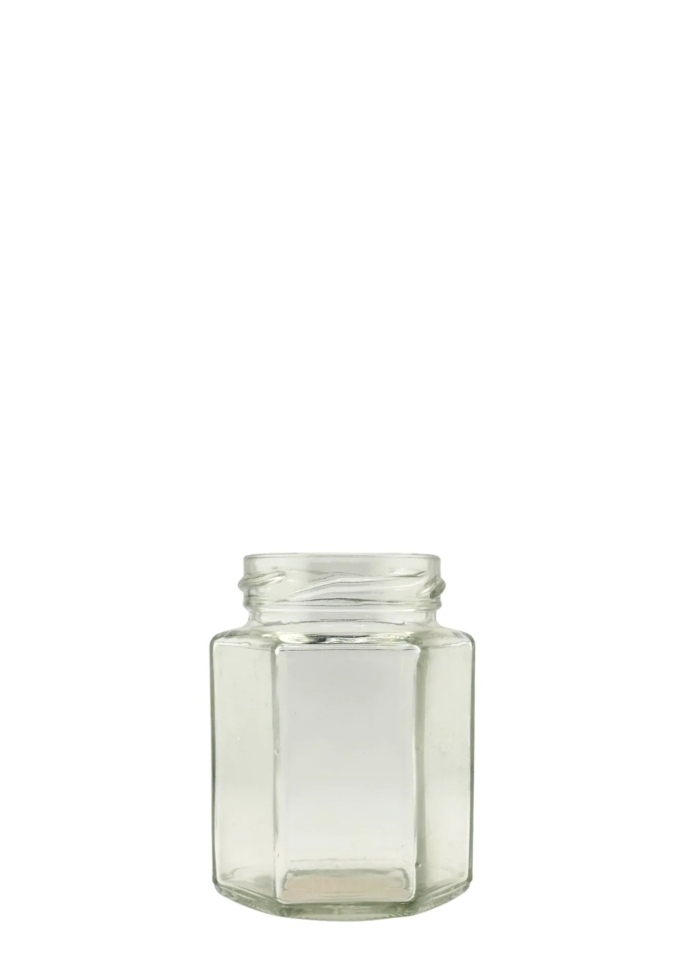 Bocal en verre hexagonal transparent de 116 ml pour miel, sur fond blanc.